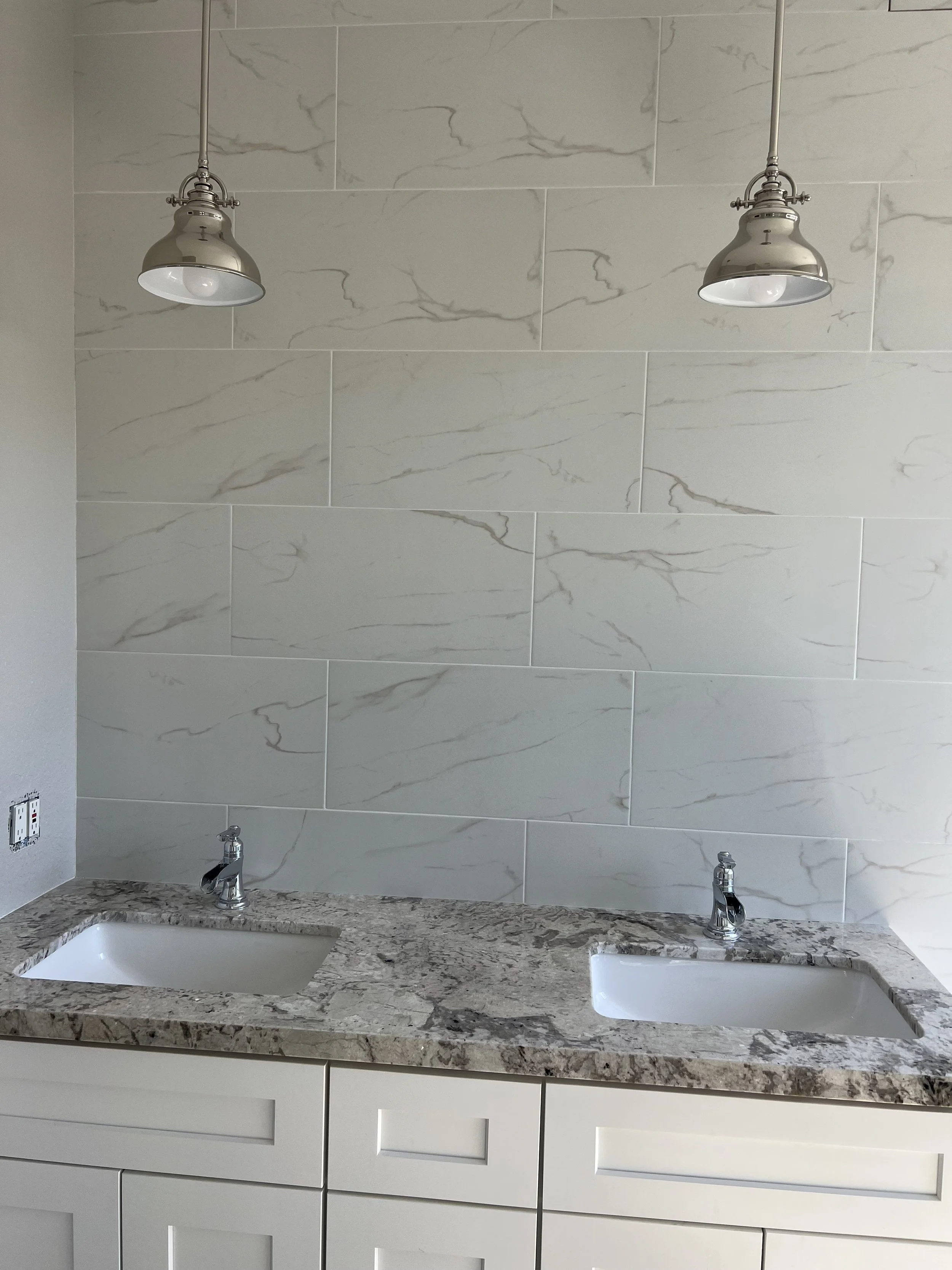Vanity countertops and tiled wall
