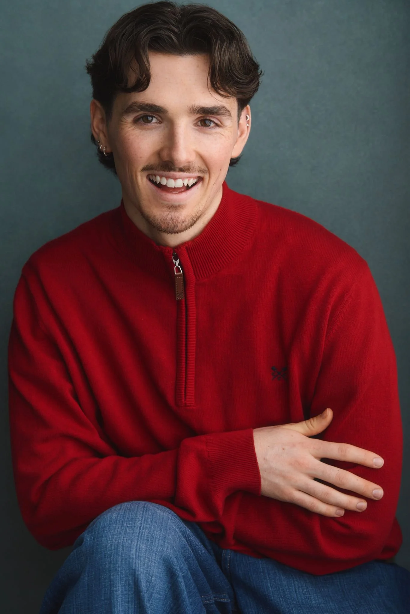 A headshot of our upper school singing and movement teacher Aidan Watson