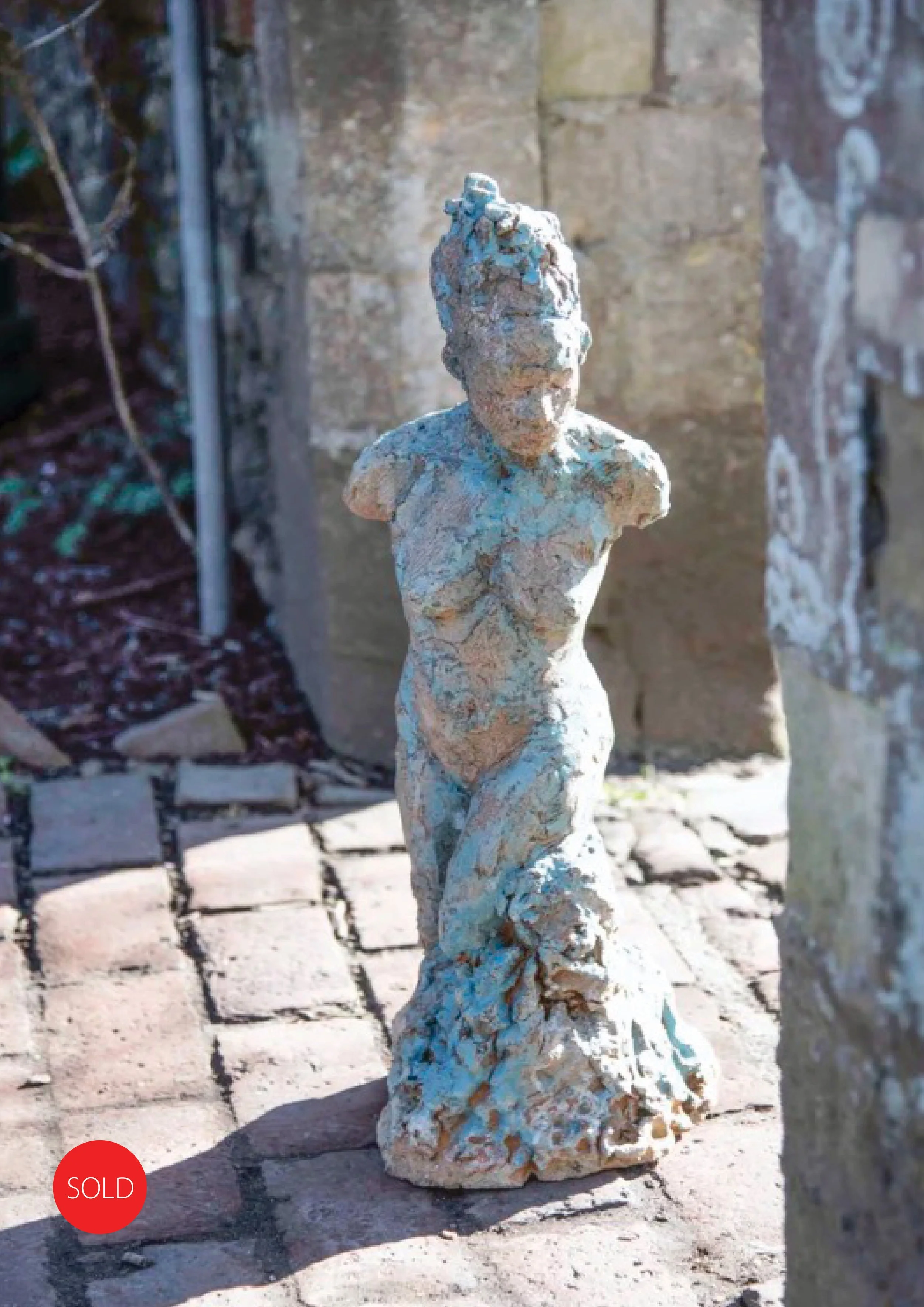 'Emerging' ceramic figure by Sarah Money