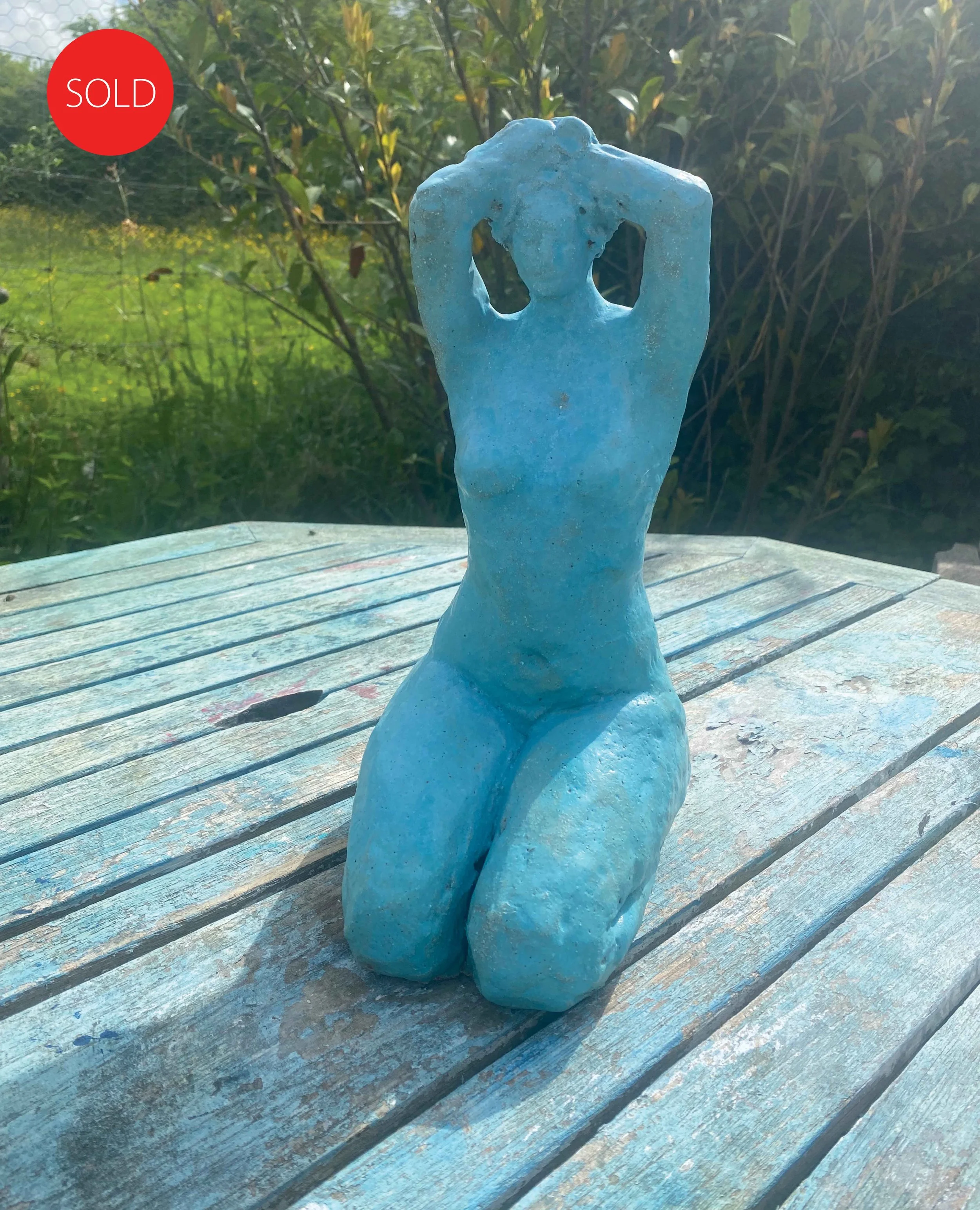 Ceramic kneeling figure
