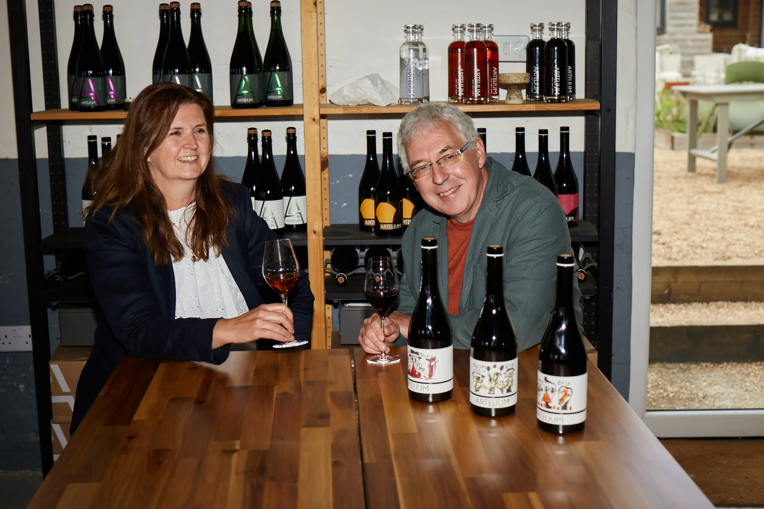 Founders Julie and Mark in the Artelium tasting room with Artefact wines 