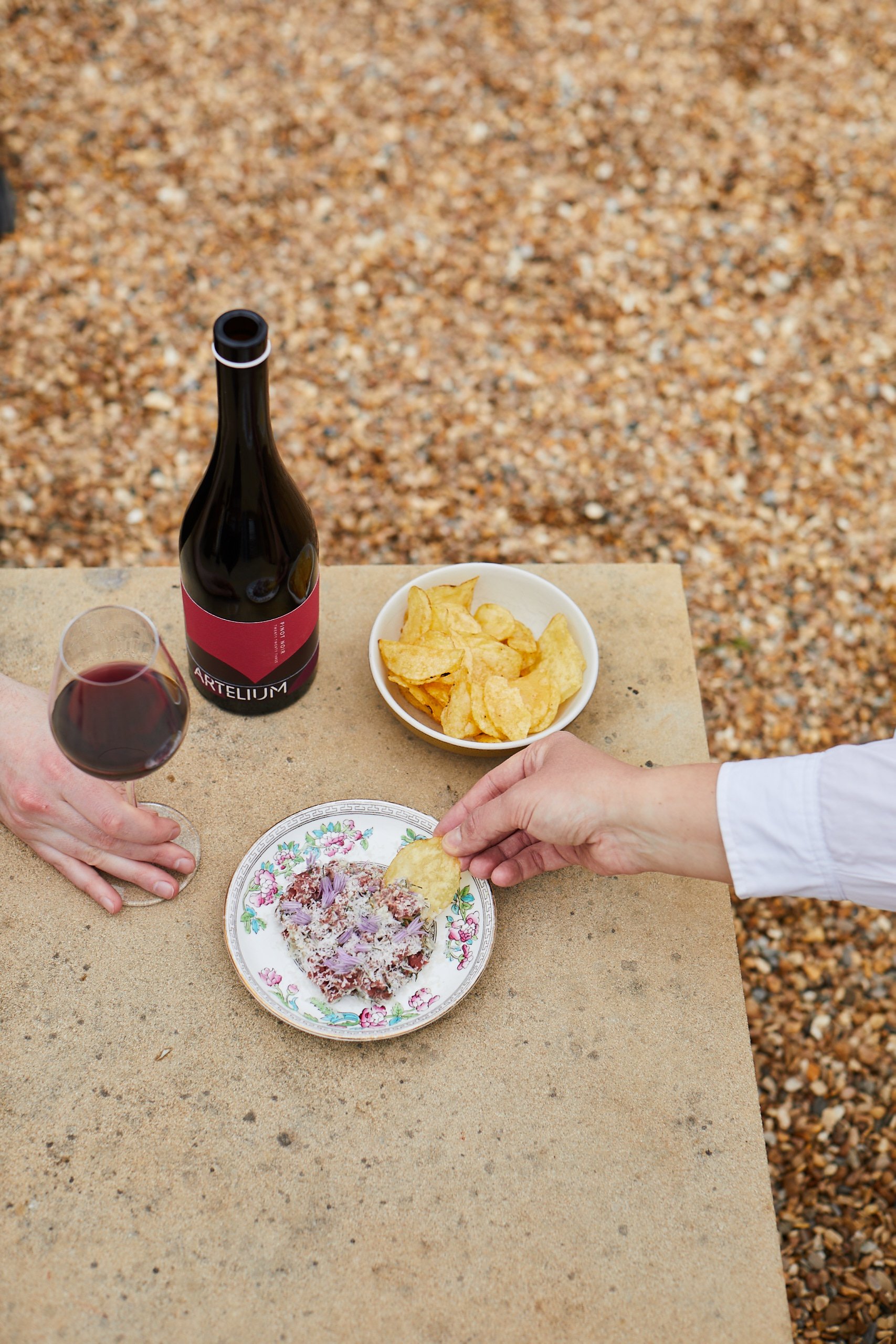 Artelium Pinot Noir paired with Sussex Wagyu beef tartare & crisps enjoyed on the terrace 