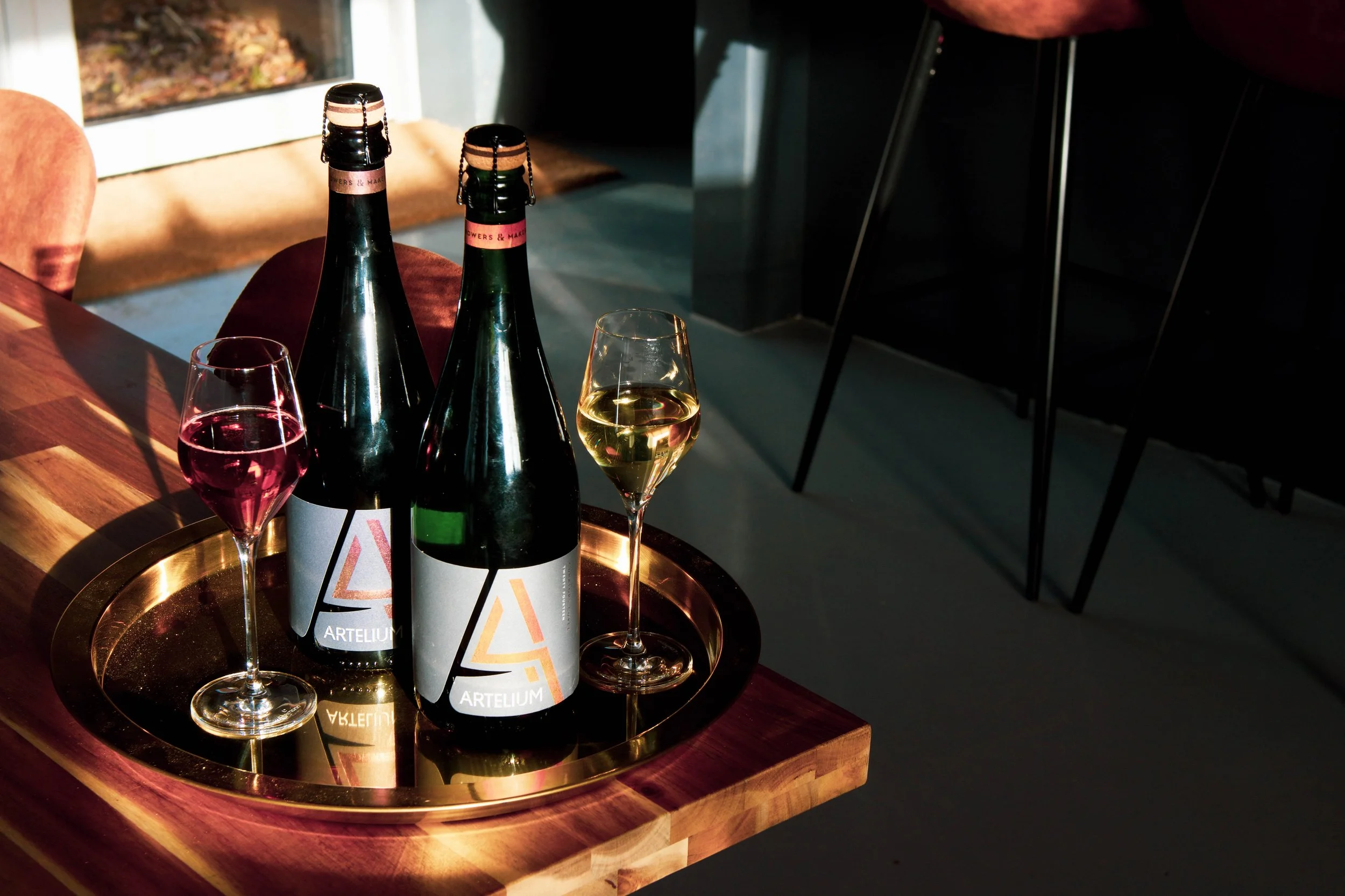 Artelium Makers Rosé & Curators Cuvée lifestyle shot in tasting room 