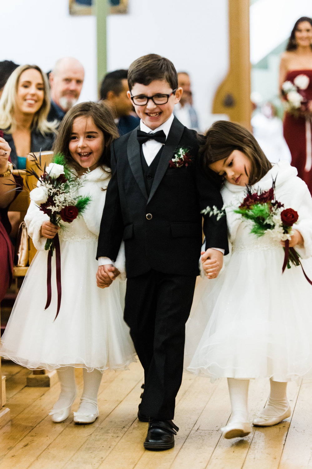 flower girls and page boy walking down aisle at st fiacres wedding