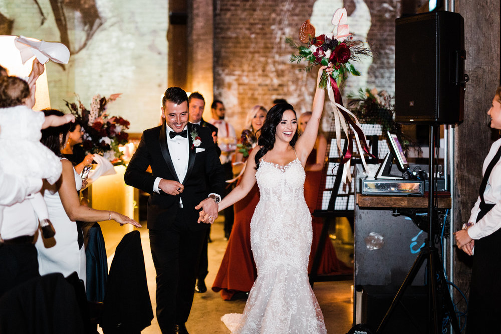 couple entering restaurant bar m in ruschutters bay wedding
