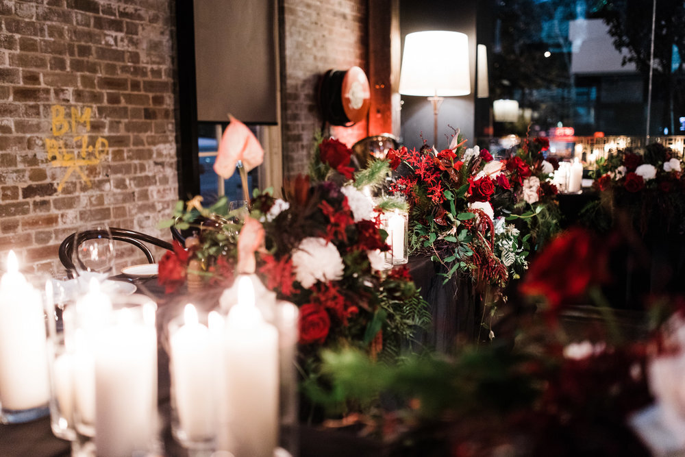 candlelight and lush flowers bridal table at bar m rushcutters bay