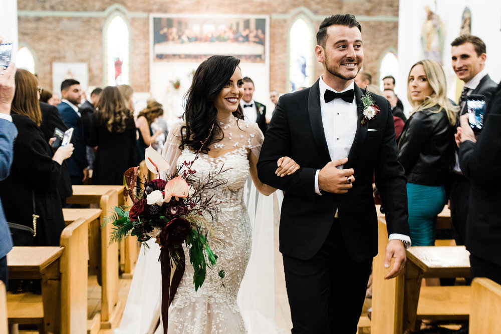 bride and groom walking down aisle at sydney church