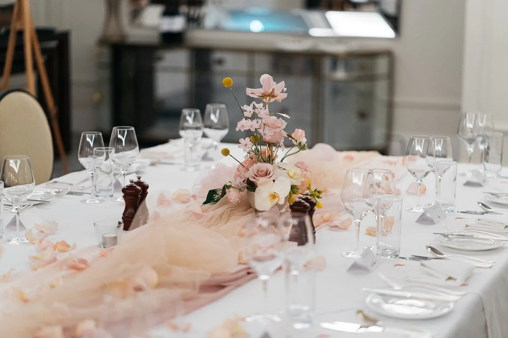 table setting at the langham with fabric styling and flowers