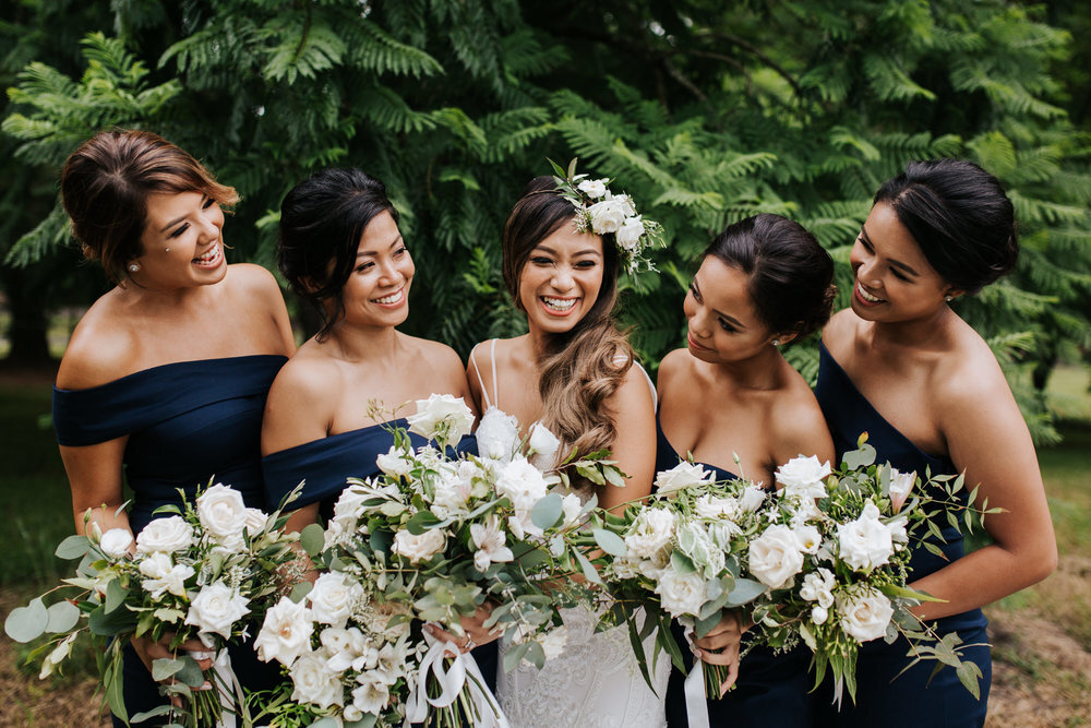bridal party holding their bouquets