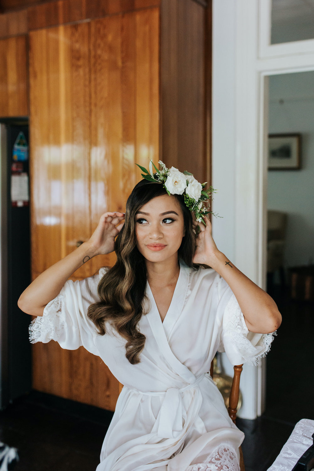 bride getting ready with flower crown