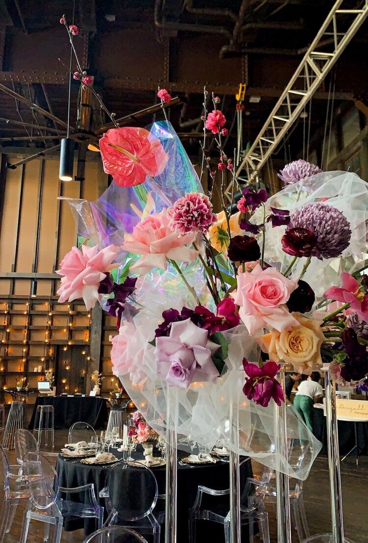 fabric styling with bright bold flowers at ovolo wedding showcase