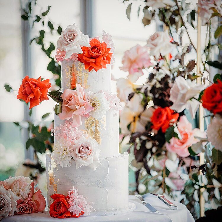 tiered wedding cake with roses and gold leaf stacy brewer