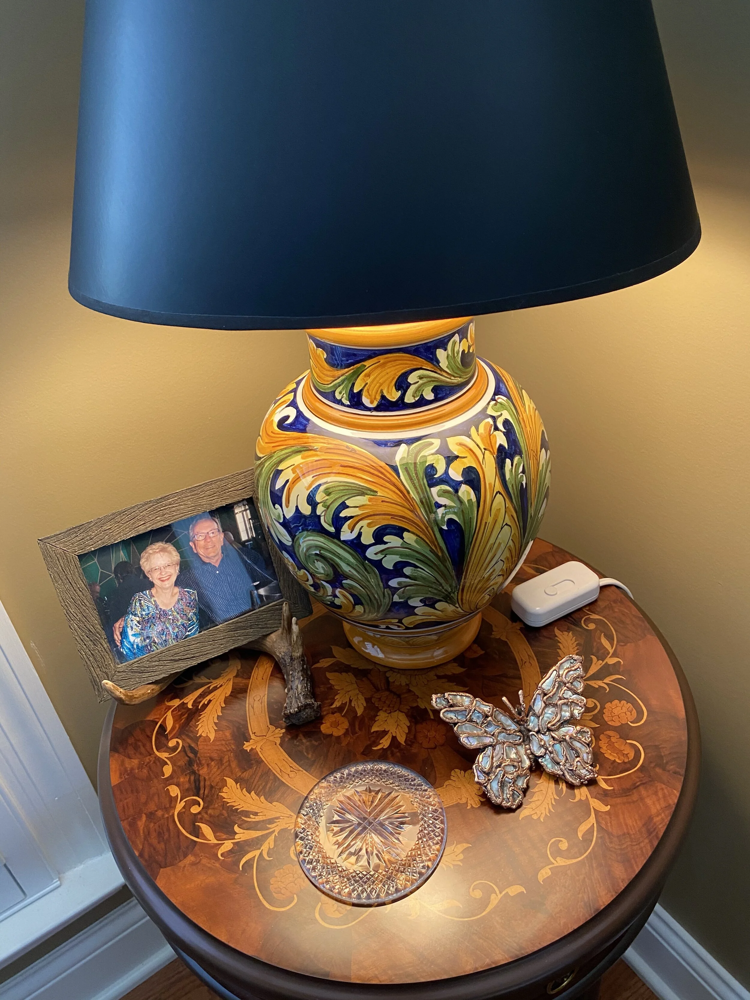 Inlaid wood table from Sorrento, the hand painted lamp from Taormina