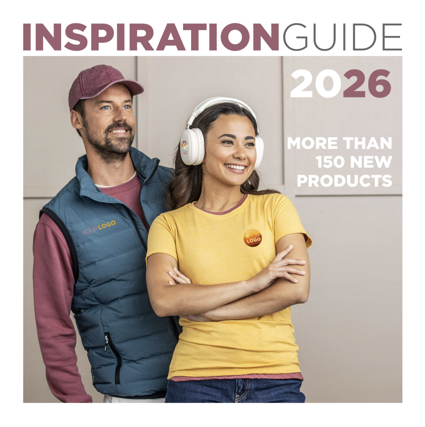 A man and a woman standing together, smiling, with the woman wearing headphones. The image is a cover for a guide titled "Inspiration Guide 2026" with text mentioning "More than 150 new products". The man is wearing a maroon cap, a blue vest over a maroon shirt, while the woman is wearing a yellow t-shirt with a logo and has her arms crossed.