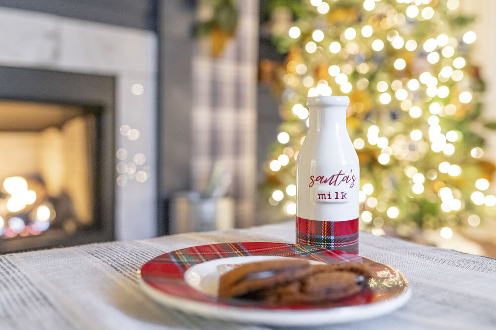Santa milk and cookie in front of fireplace