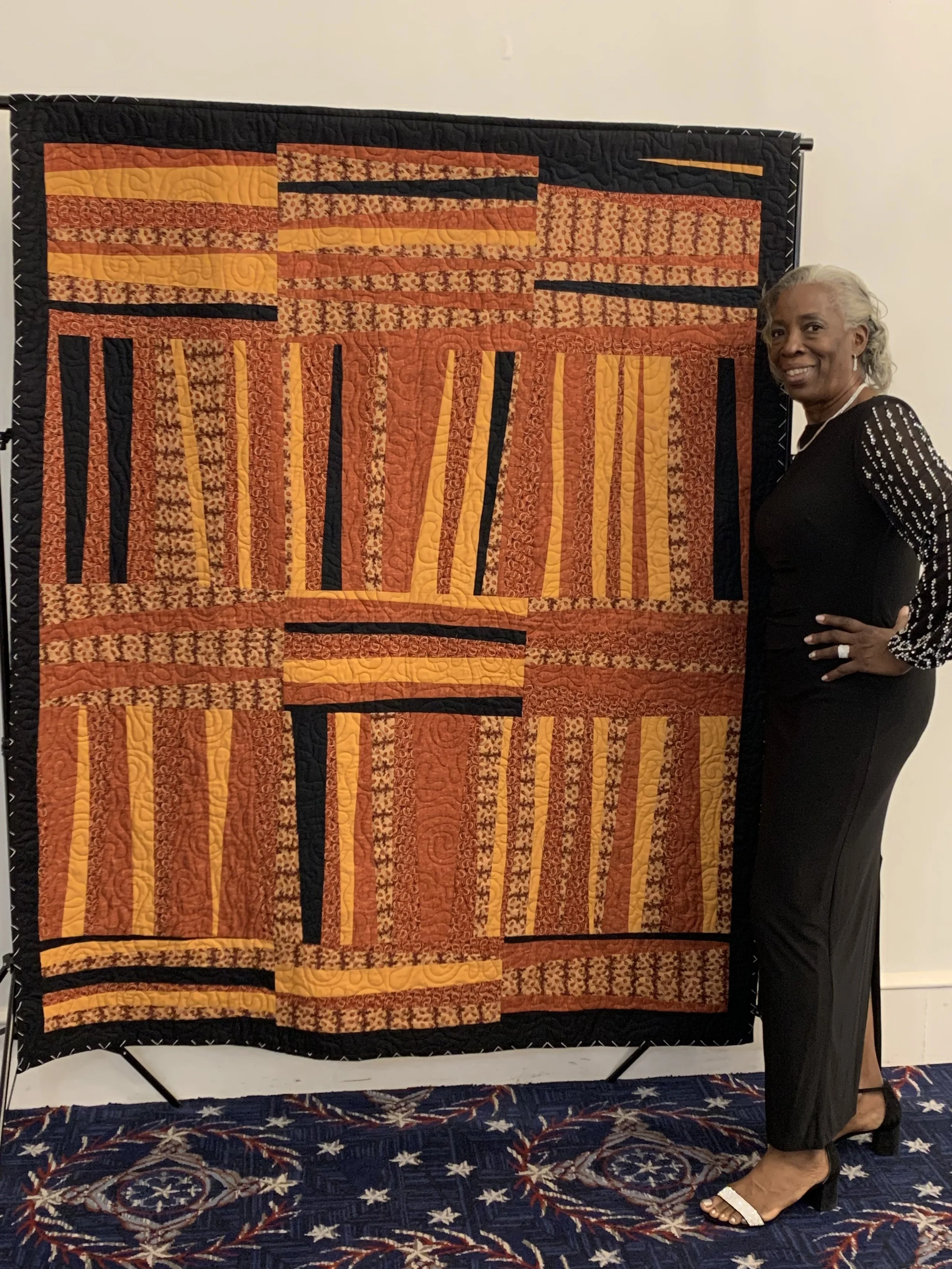 Thadine with quilt.jpg