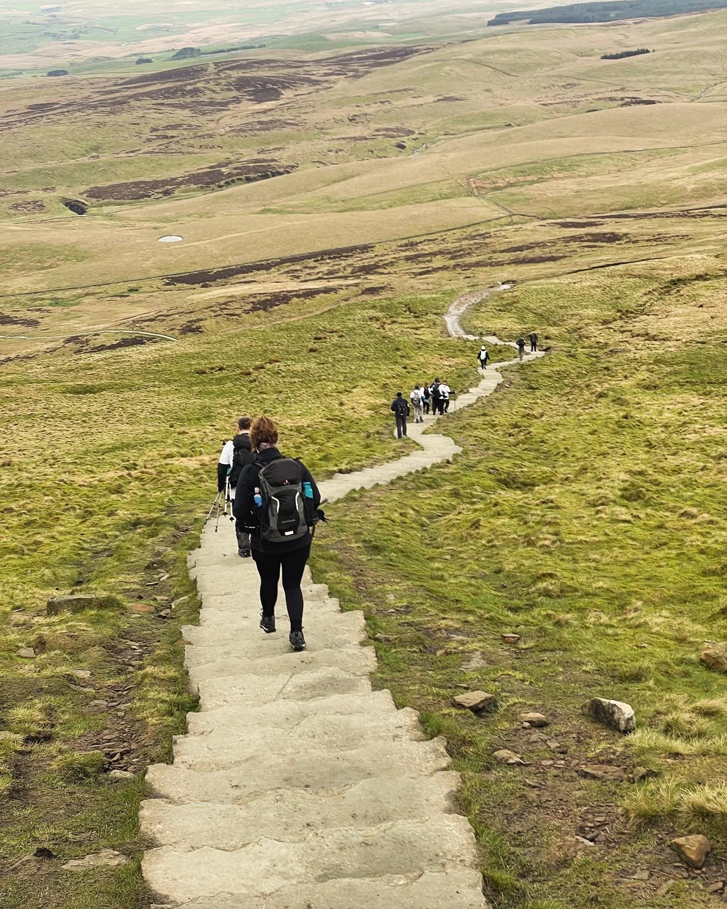 hikers descending from pen y ghent during the yorkshire three peaks challenge with yonder adventure company