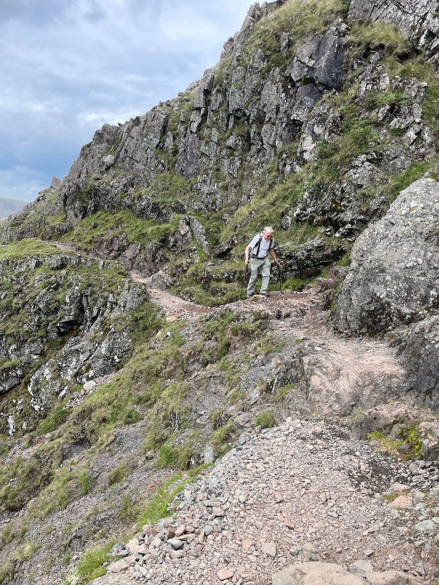 a hiker on the corridor route ascending scafell pike