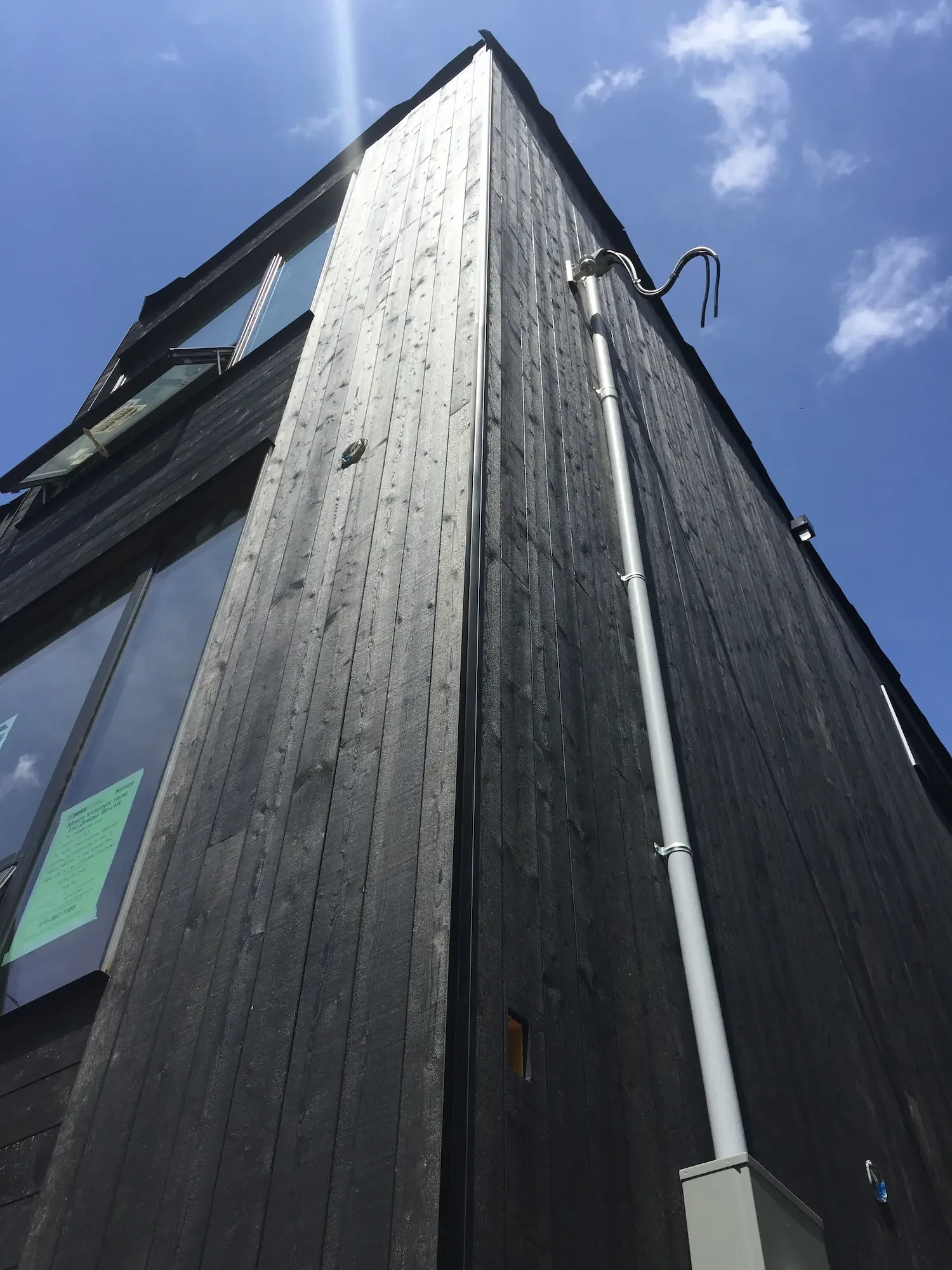 Two-story Maibec black cladding corner view - North Riverdale by Odin Agnuk