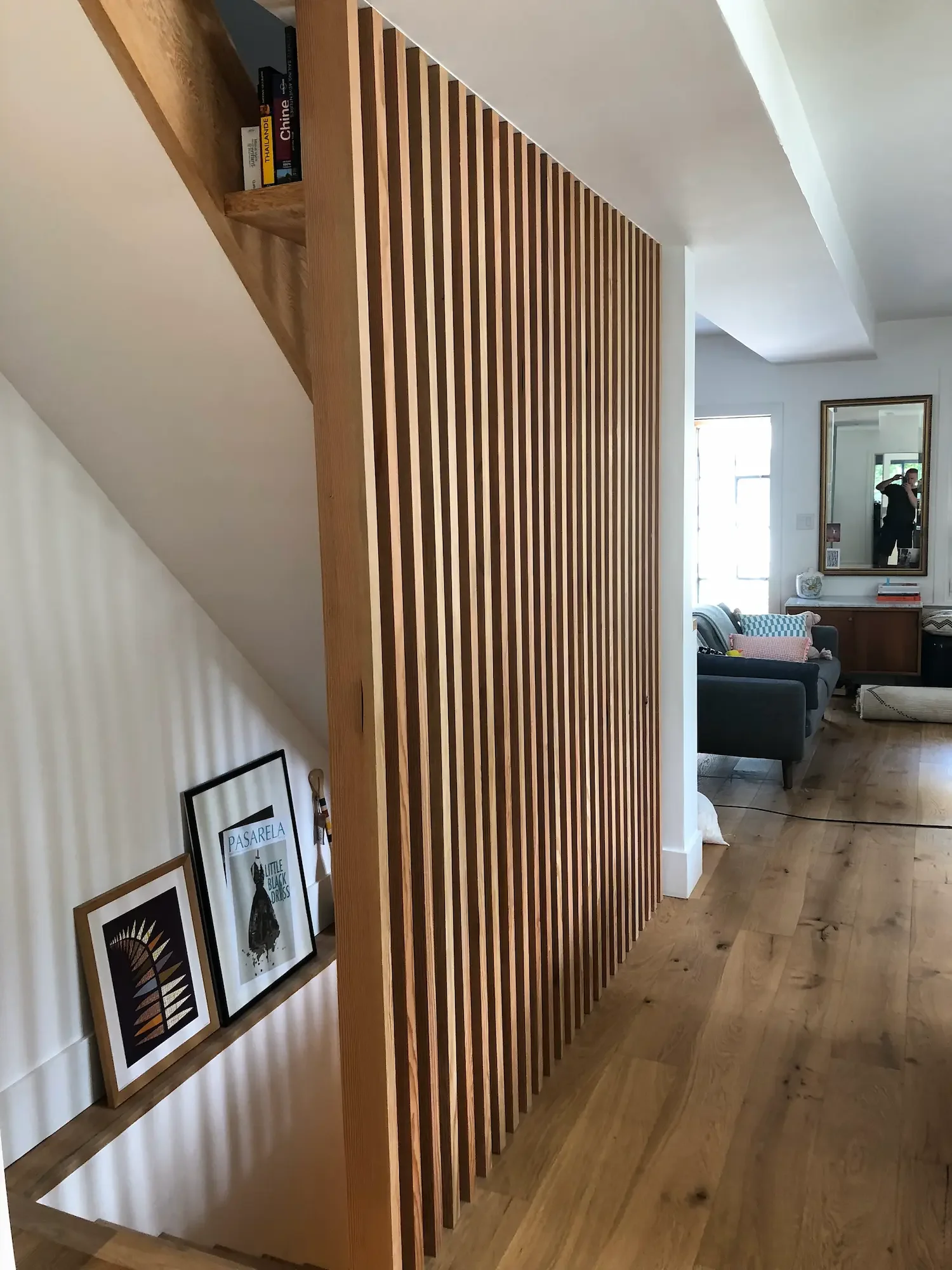 Custom architectural screen divider between staircase and living room - The Beaches Toronto by Odin Agnuk