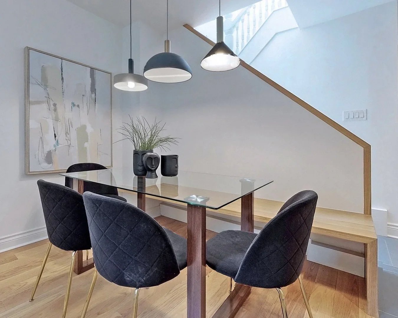Built in bench with oak railing and refinished hardwood floors in Leslieville Toronto by Odin Agnuk
