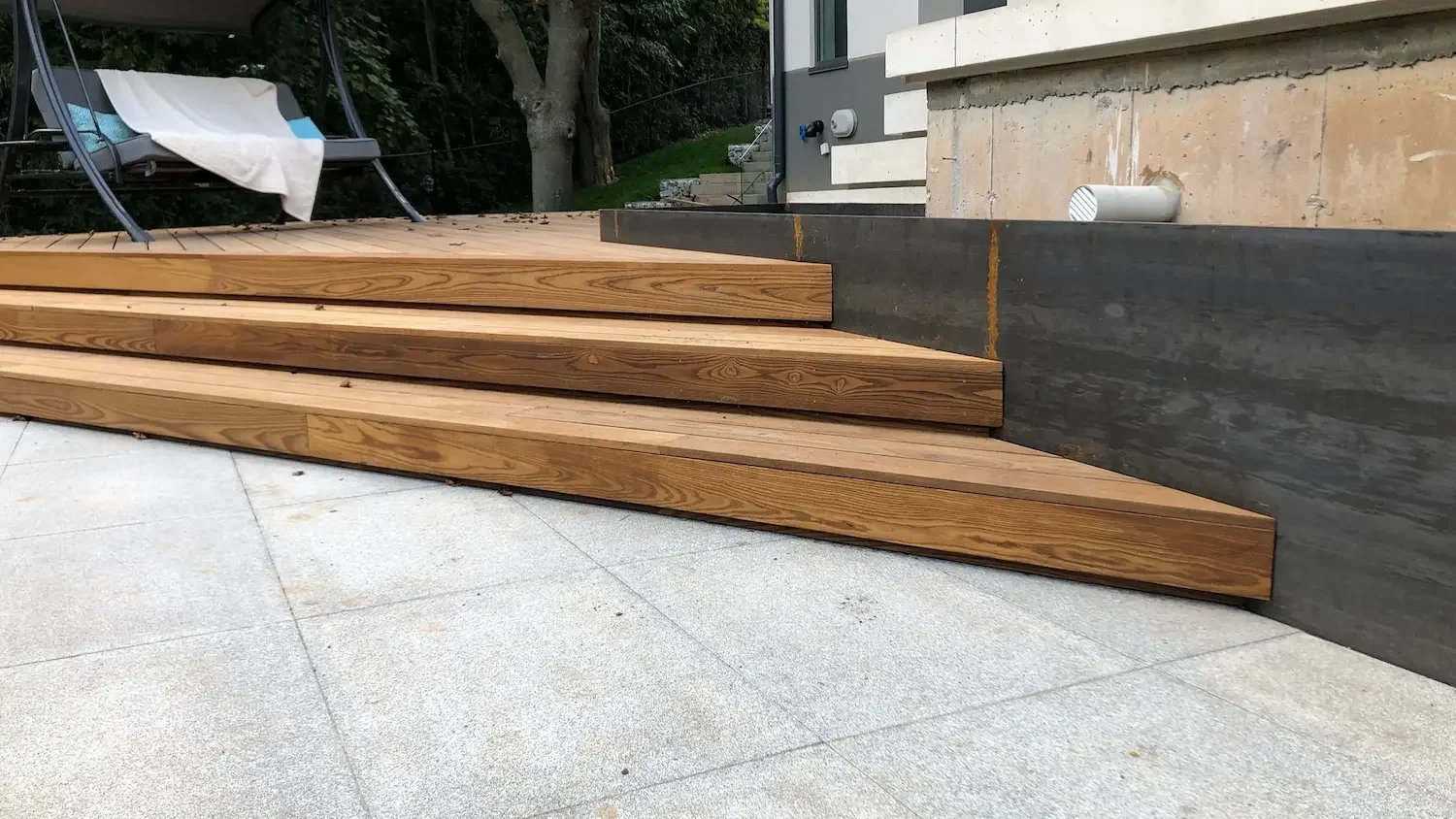 Thermory ash deck stairs close-up showing wood grain detail with steel planter in Brant Hills Burlington by Odin Agnuk