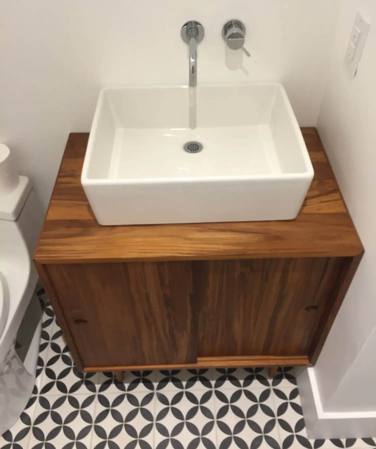Custom built teak bathroom vanity with wall-mounted faucet and white vessel sink - The Beaches by Odin Agnuk
