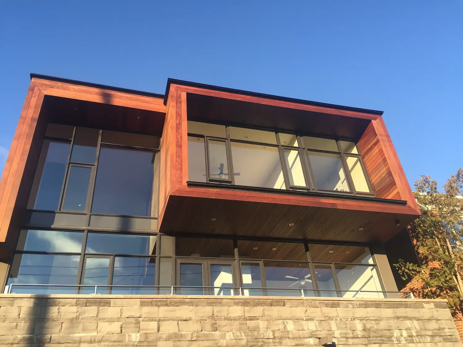 Completed horizontal ipe cladding installation exterior transitioning to inside of home in Toronto by Odin Agnuk