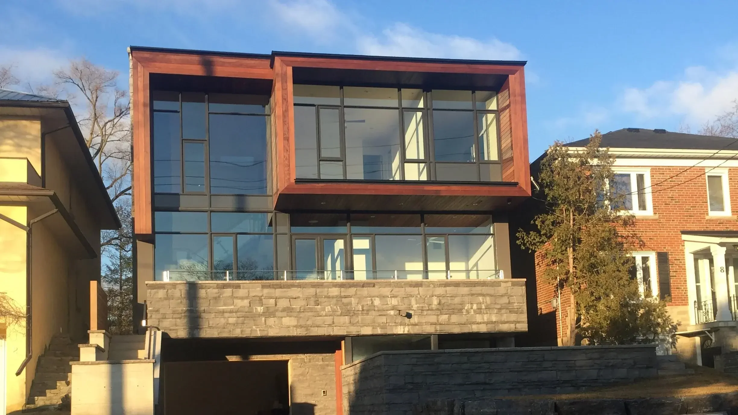 Completed ipe horizontal siding on modern custom home exterior in Toronto by Odin Agnuk