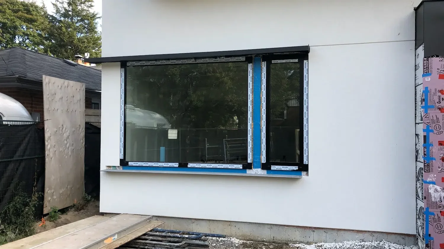 Before custom vertical louvered screen clad in Trespa Pura NFC at Scarborough Bluffs home by Odin Agnuk