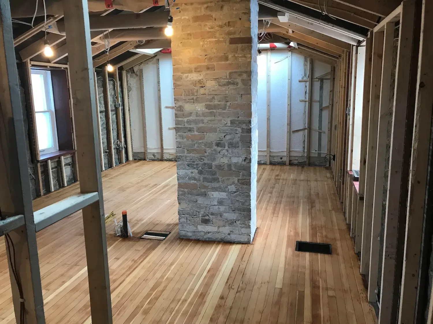 Whole home gut renovation with exposed brick and hardwood floors - Guelph by Odin Agnuk