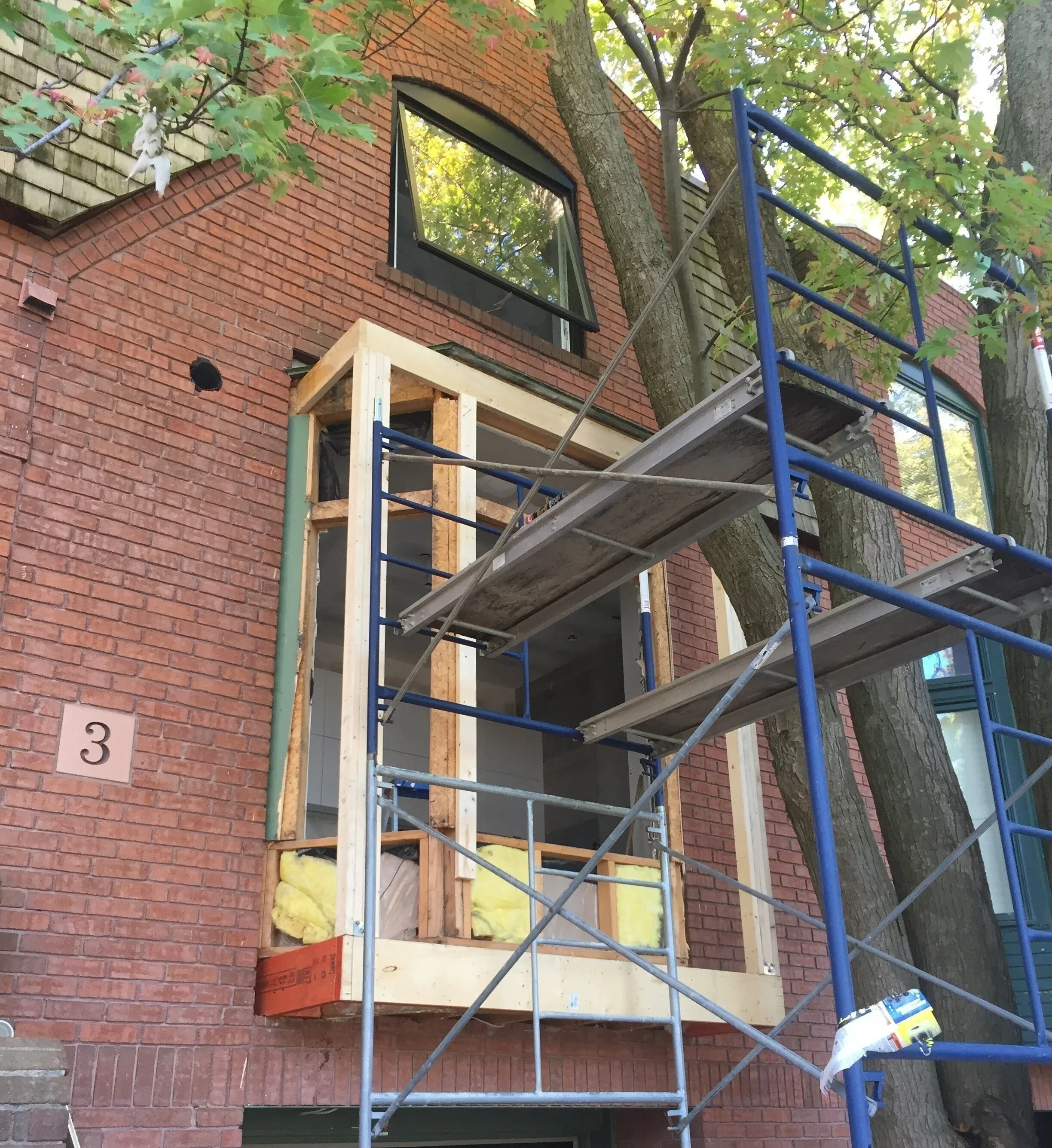 Bay window framing and construction on brick row house in The Pocket Toronto by Odin Agnuk