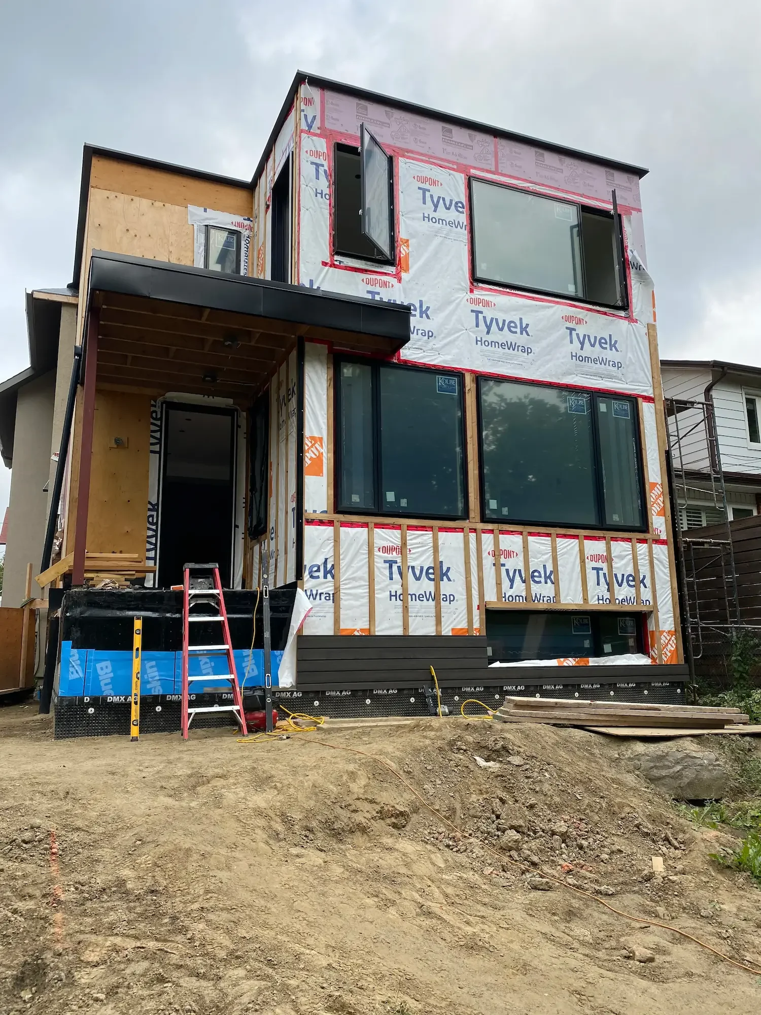 Custom home with Tyvek house wrap before Maibec cladding installation - Toronto by Odin Agnuk