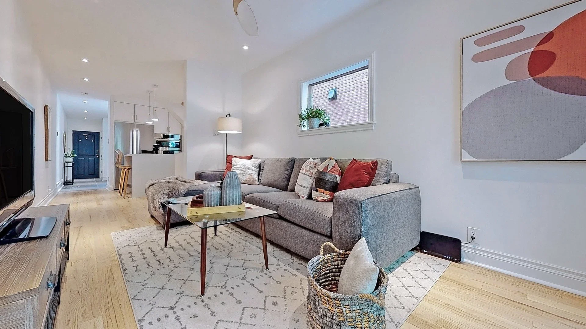 Open concept main floor renovation with refinished hardwood floors in Leslieville by Odin Agnuk