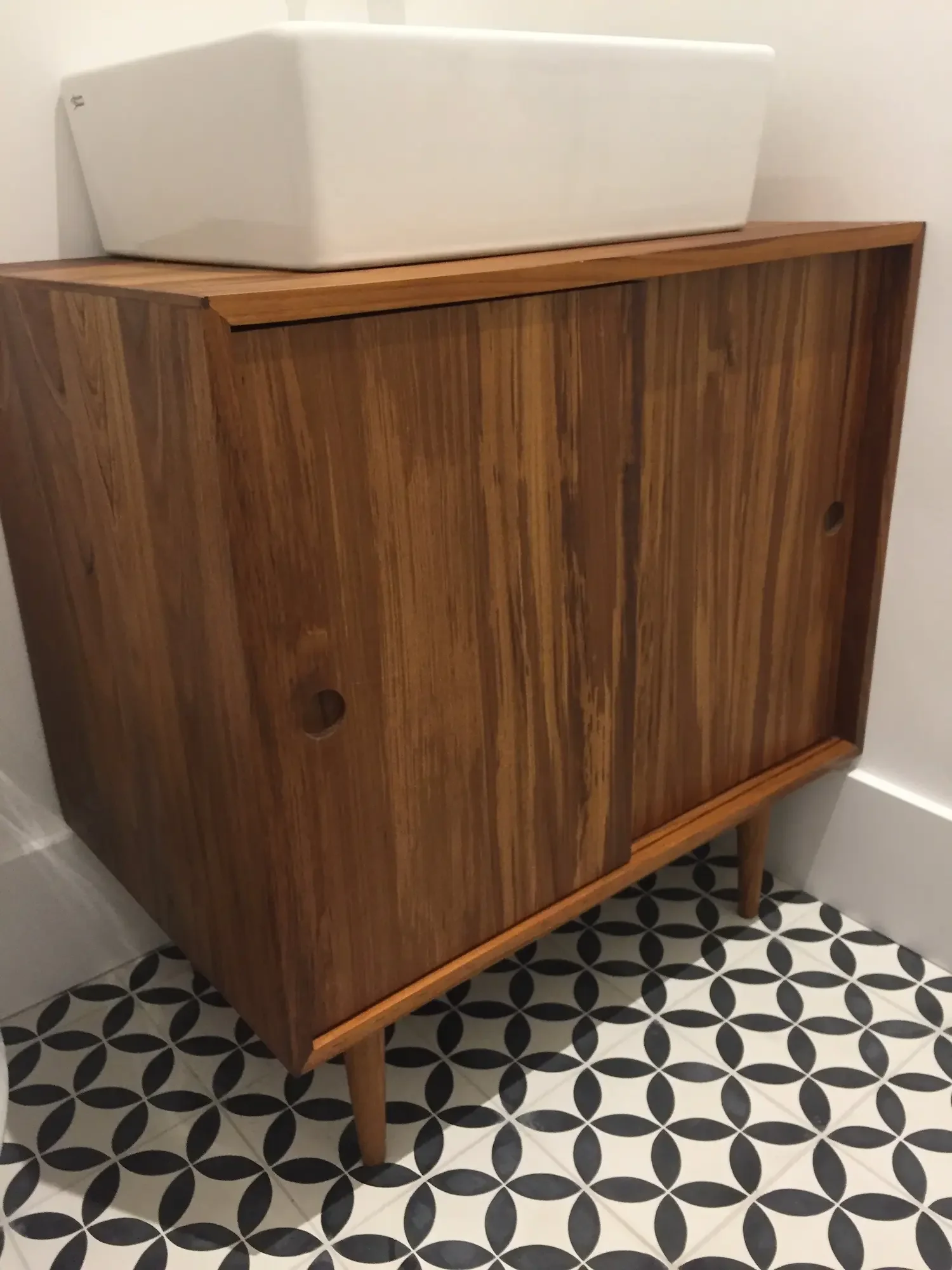 Custom built teak vanity with vessel sink and patterned floor tile - The Beaches by Odin Agnuk