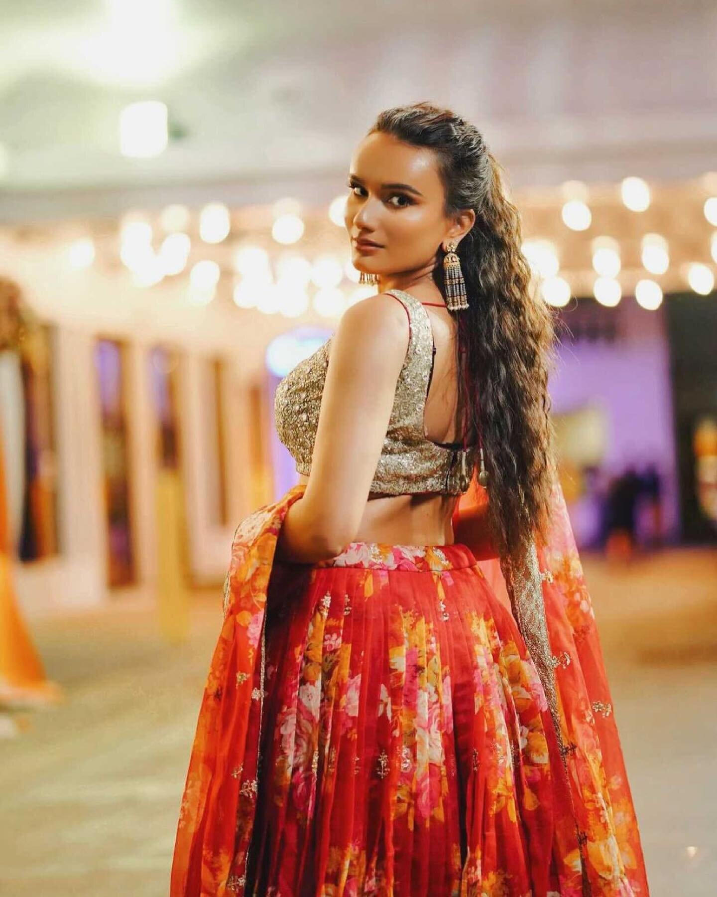 Can&rsquo;t get our 👀 off of her 😍

@devarshissoni wearing a printed organza Lehenga paired with a sequins mirror work blouse for a family wedding 🧡

#lehenga #lehengacholi #indianwedding #indianwear #indianbride #indianwear #weddinginspo