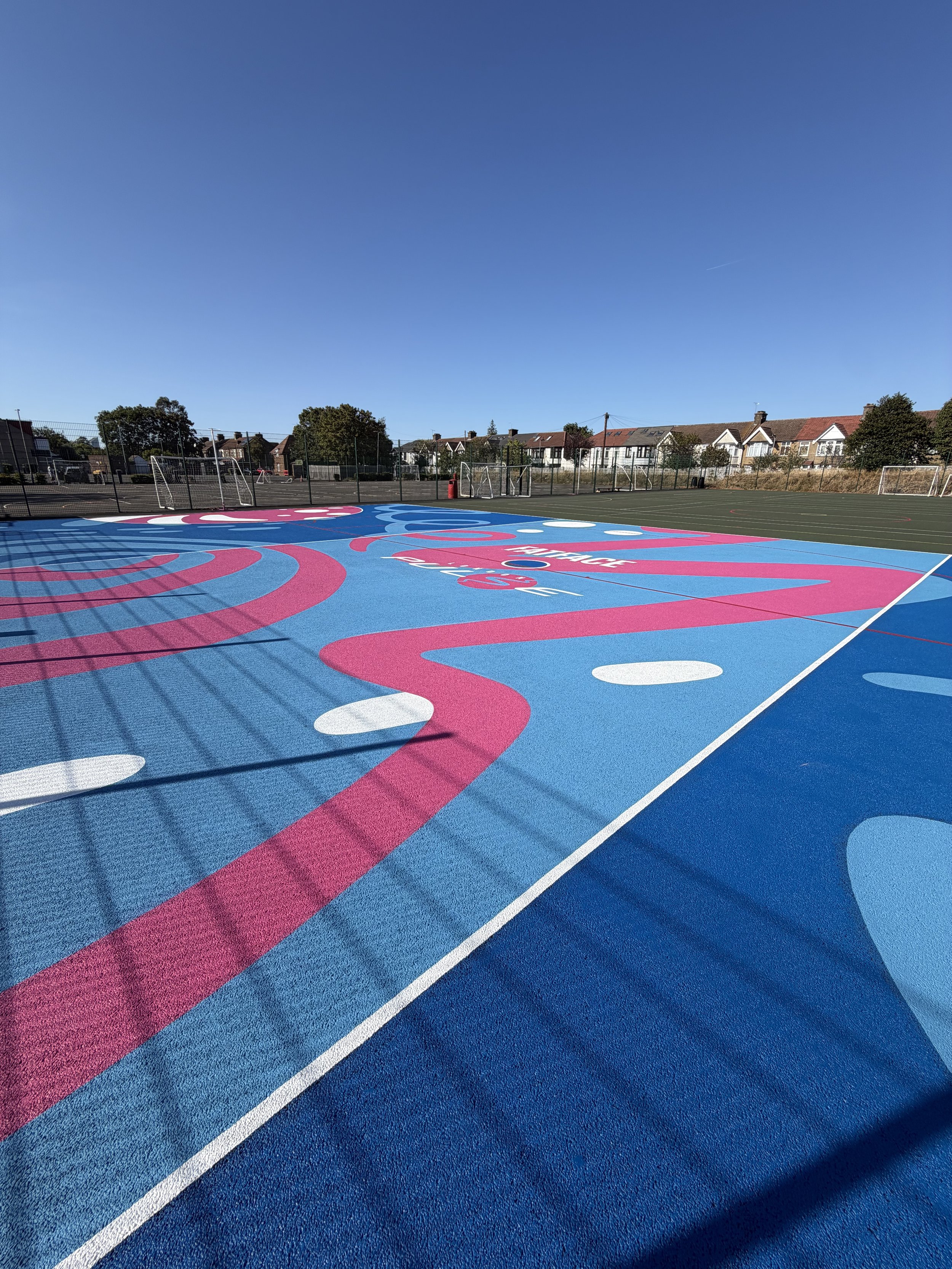 Netball Court mural painted by K&B Design for FatFace & London Pulse at Barking school.