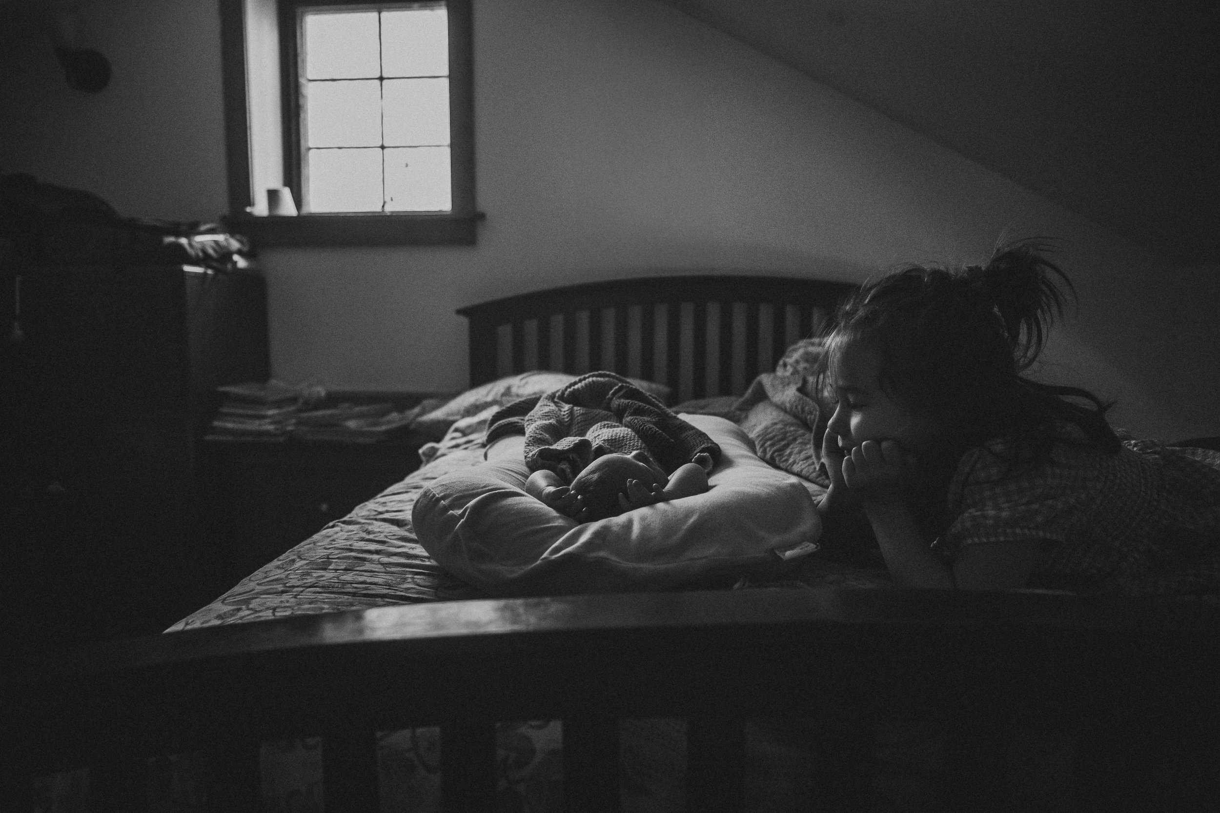 young girl looking at sibling