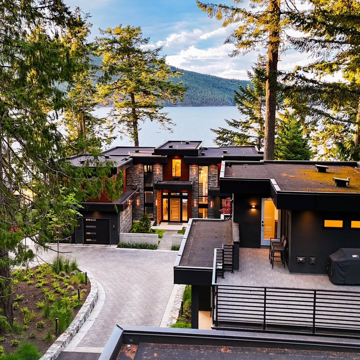 A contemporary architectural masterpiece, this property in British Columbia showcases floor-to-ceiling windows, heated patios, and private oceanfront access.

Extraordinary property of the day represented by Logan Wilson, Brayden Klein, and Harley Sh