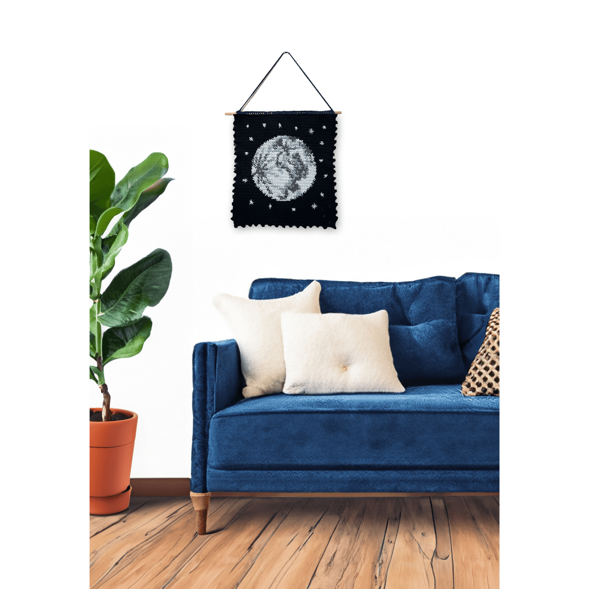 Moon tapestry crochet wall hanging on wall.png