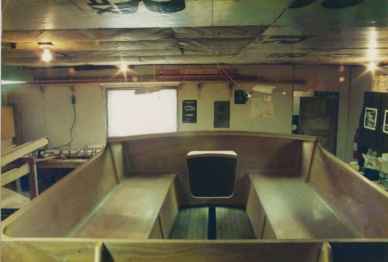 Looking forward into the cuddy; the cockpit seats are a full 8' long. Teak-strip cockpit sole has been installed.