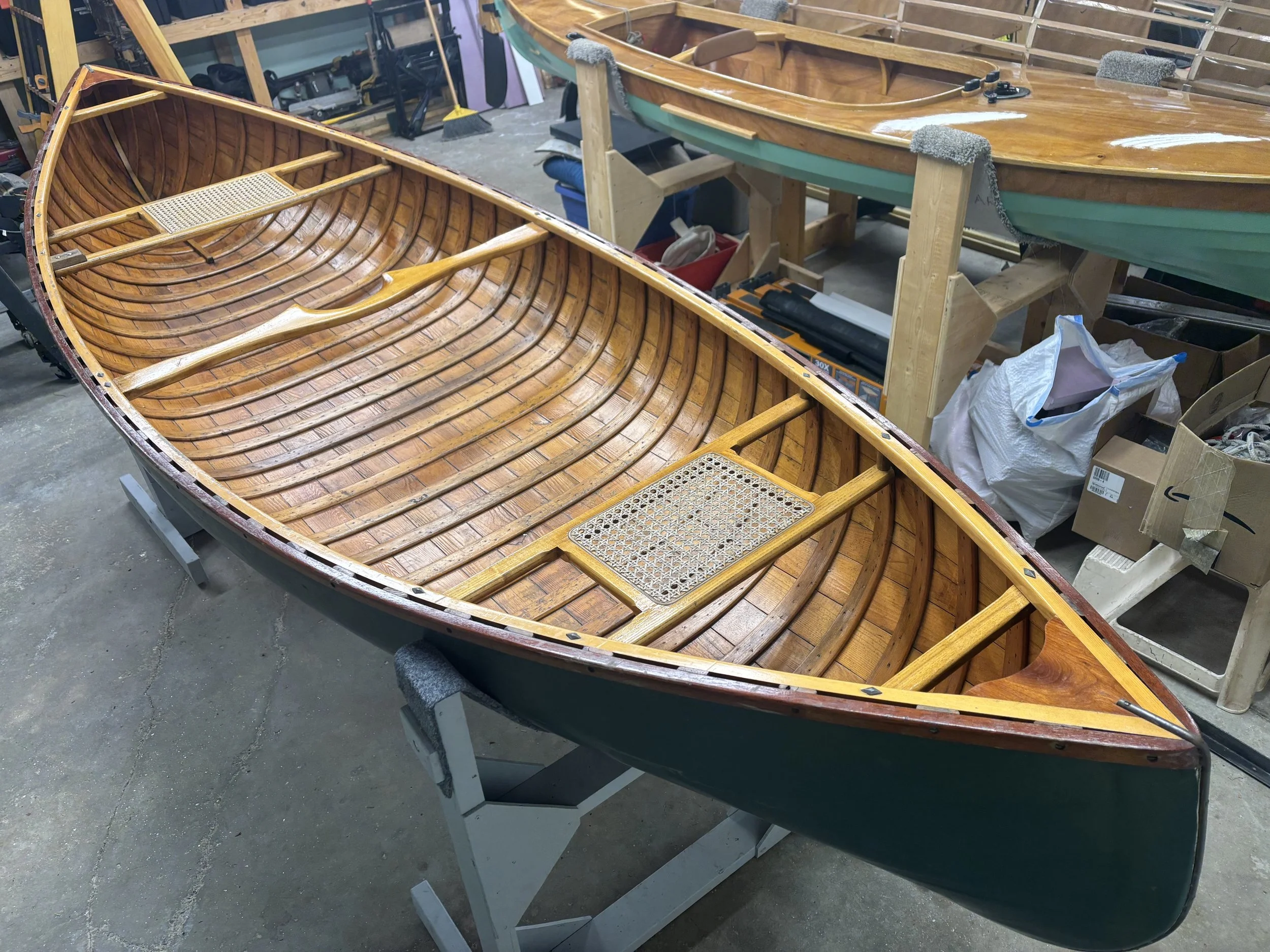 At some point in the past the canvas skin had been removed and the canoe was sheathed in fiberglass, presenting some challenges to the restoration. 