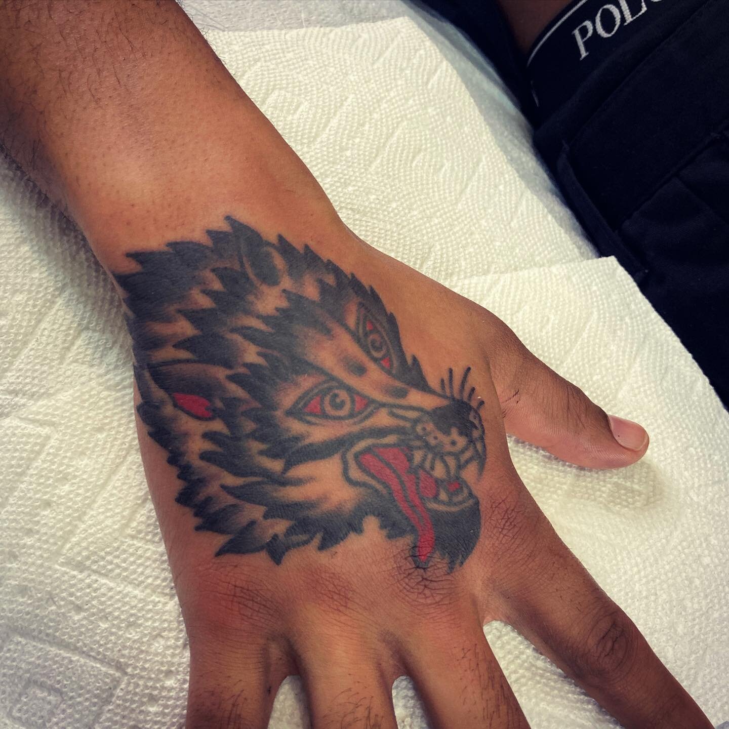 A #wolftattoo from #thegoodbook for Tyrel 
.
.
.
.
.
#acmetattoocville #spitfiretattoocville #cvilletattooartist #handtattoo