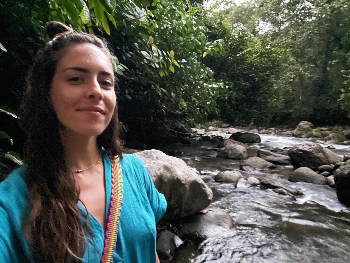 here is a picture of me in a peak moment of remembering who I truly am. a moment where the jungle rivers, warmed by a nearby volcano, and the birds that soared over head were straight out of a psychedelic vision. the color of their feathers brought t