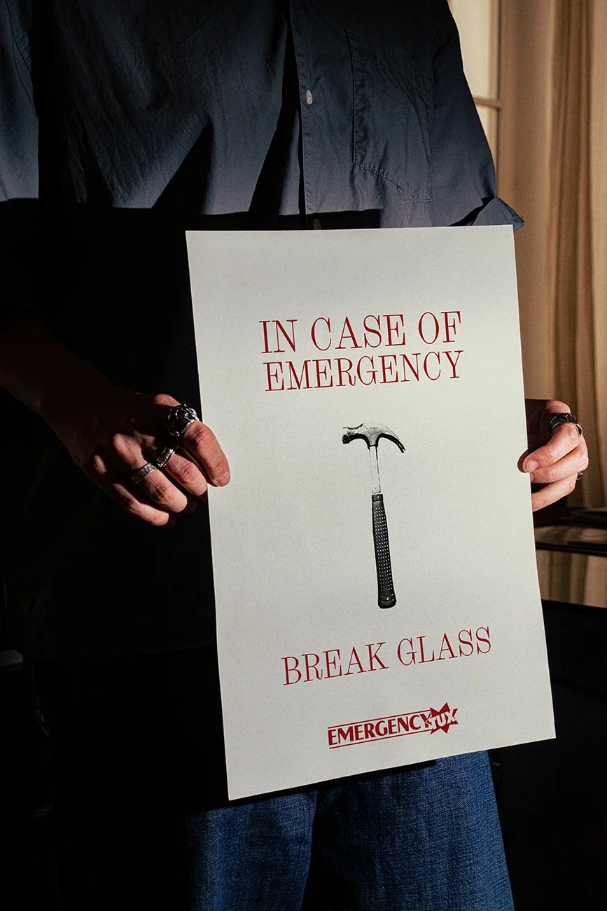 Oscar Hunt poster design advertising the Emergency Tuxedo, featuring ‘In Case of Emergency, Break Glass’ with a hammer illustration.