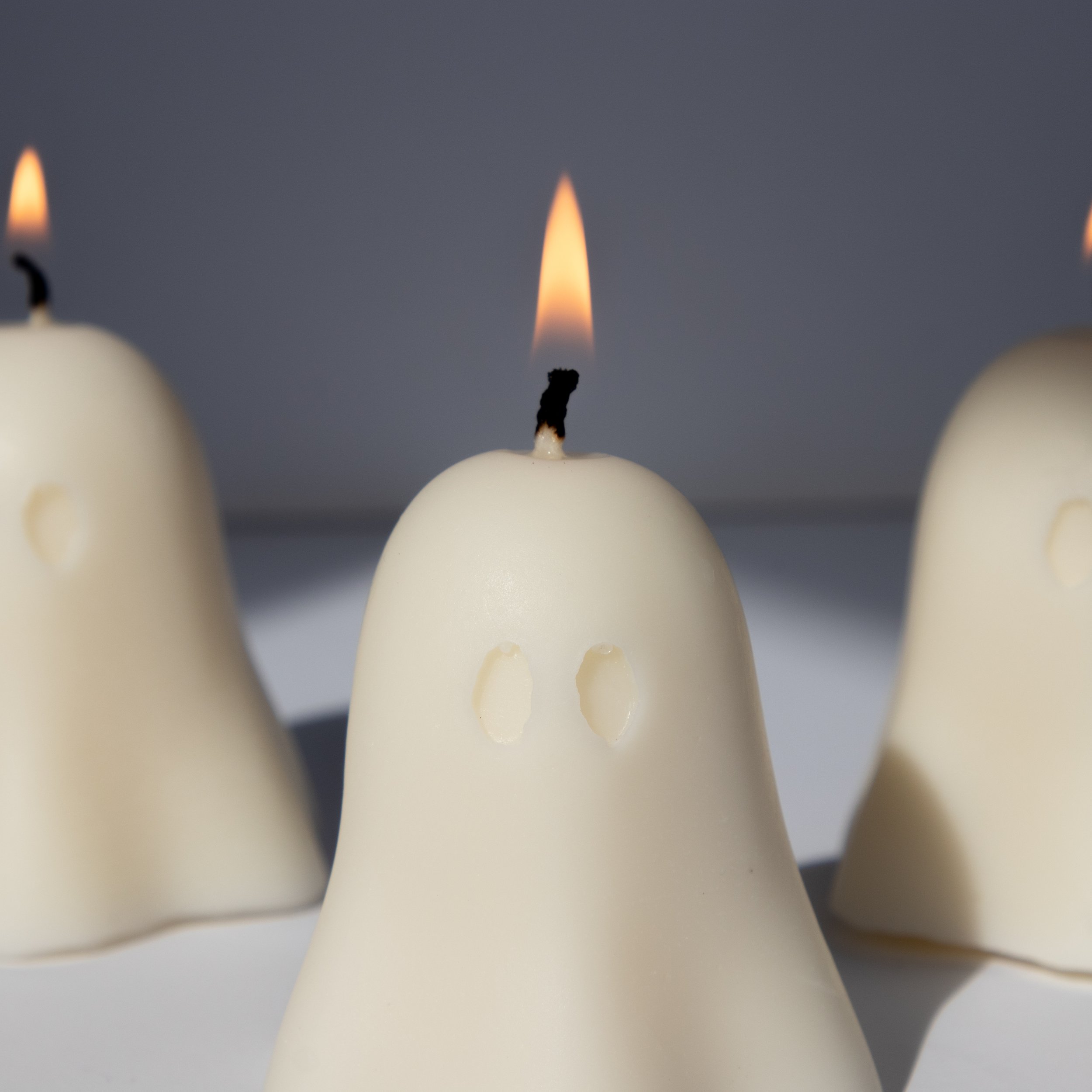 Little Ghost Candle – cute Halloween soy wax candle, lit, close up