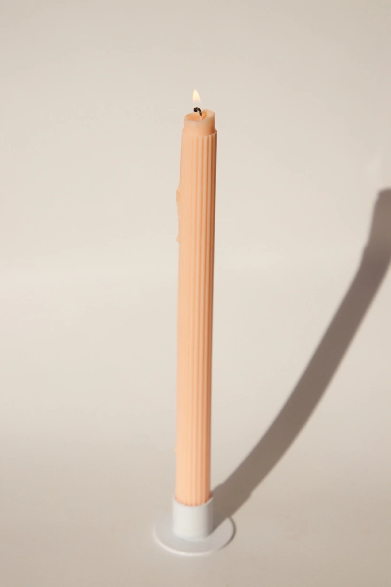 Ribbed Taper Candle lit, soft glow, handmade NZ