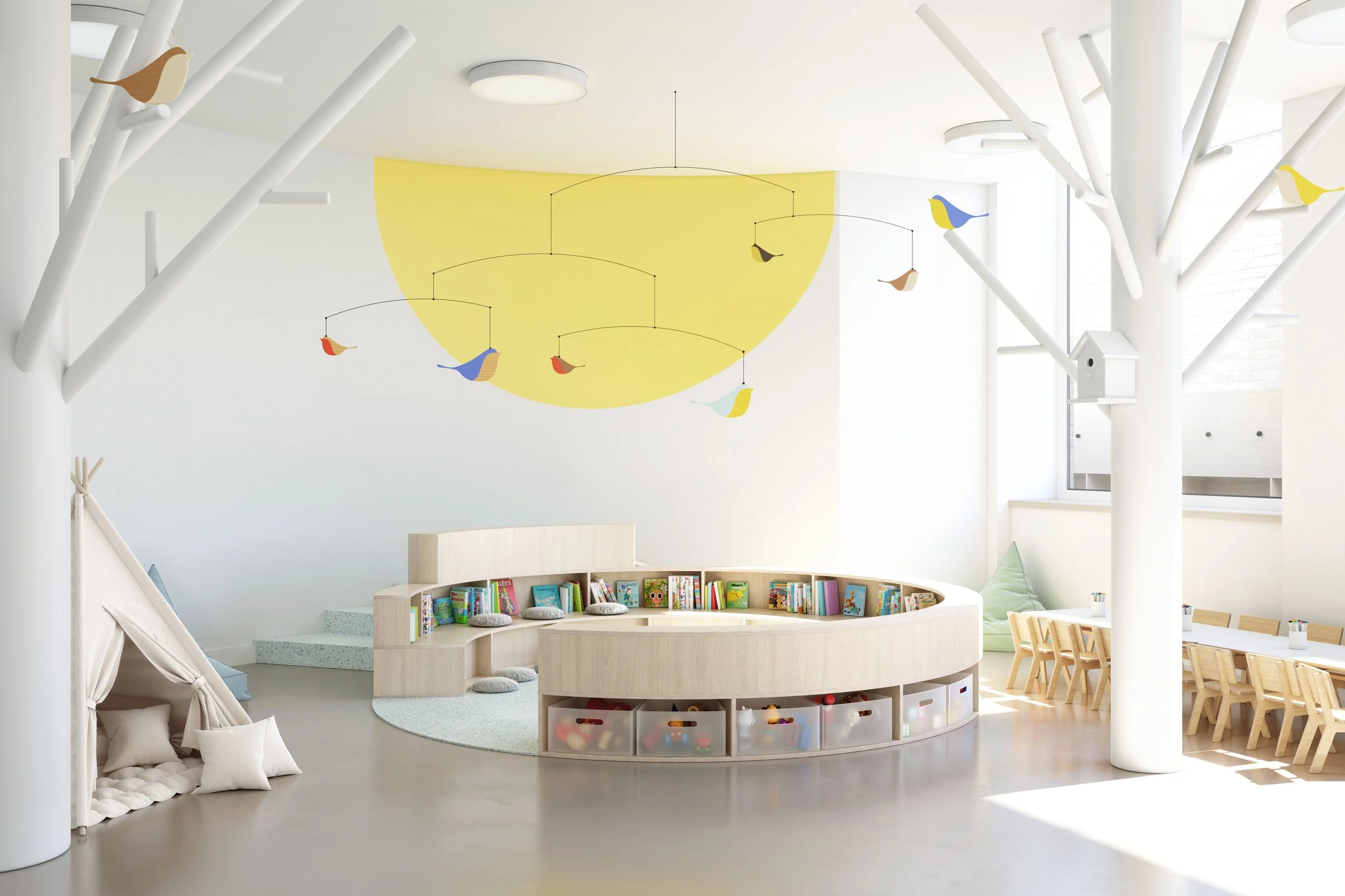 Bright early years learning environment with circular reading nook, child-sized furniture, and playful tree-inspired interior elements designed to support reading, creativity, and child-centred learning.