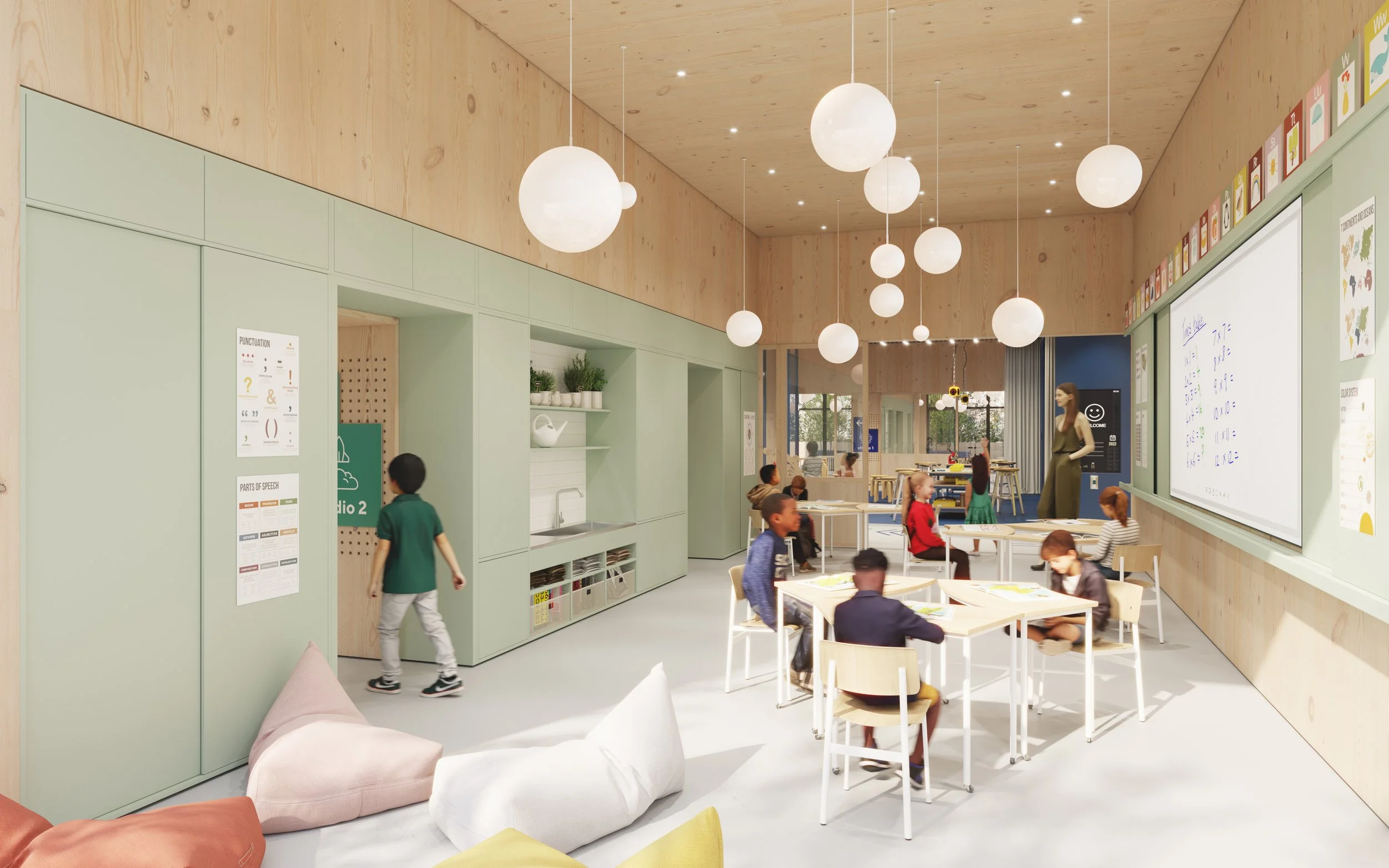 Classroom featuring soft green joinery, natural timber finishes, collaborative student worktables, integrated teaching technology, flexible seating, and adaptable learning spaces designed to support creativity, engagement, and inclusive education.