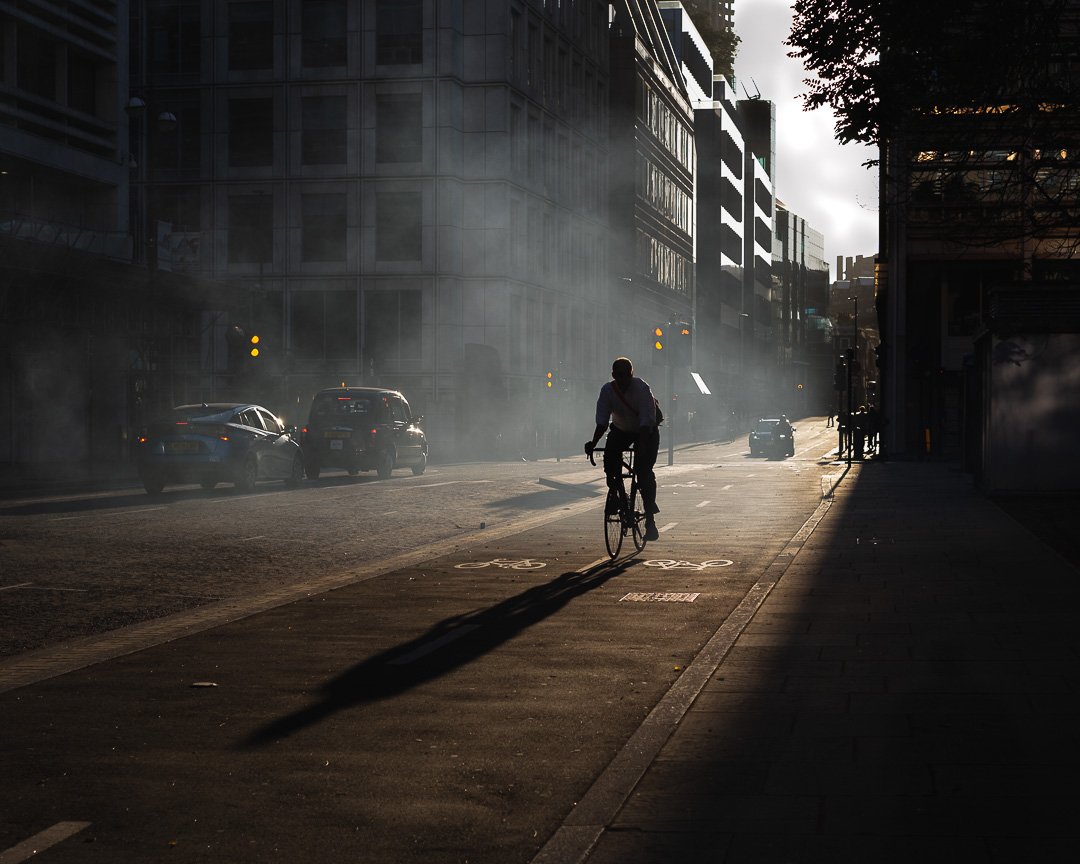 Man on bike in city.jpg